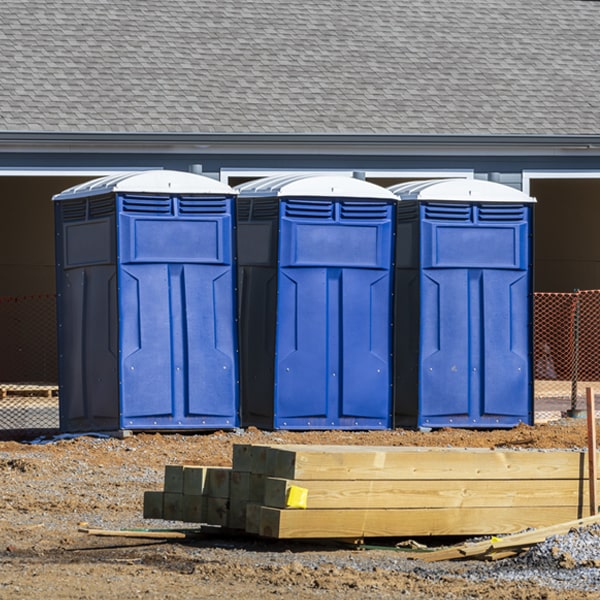 what is the cost difference between standard and deluxe portable toilet rentals in Katy